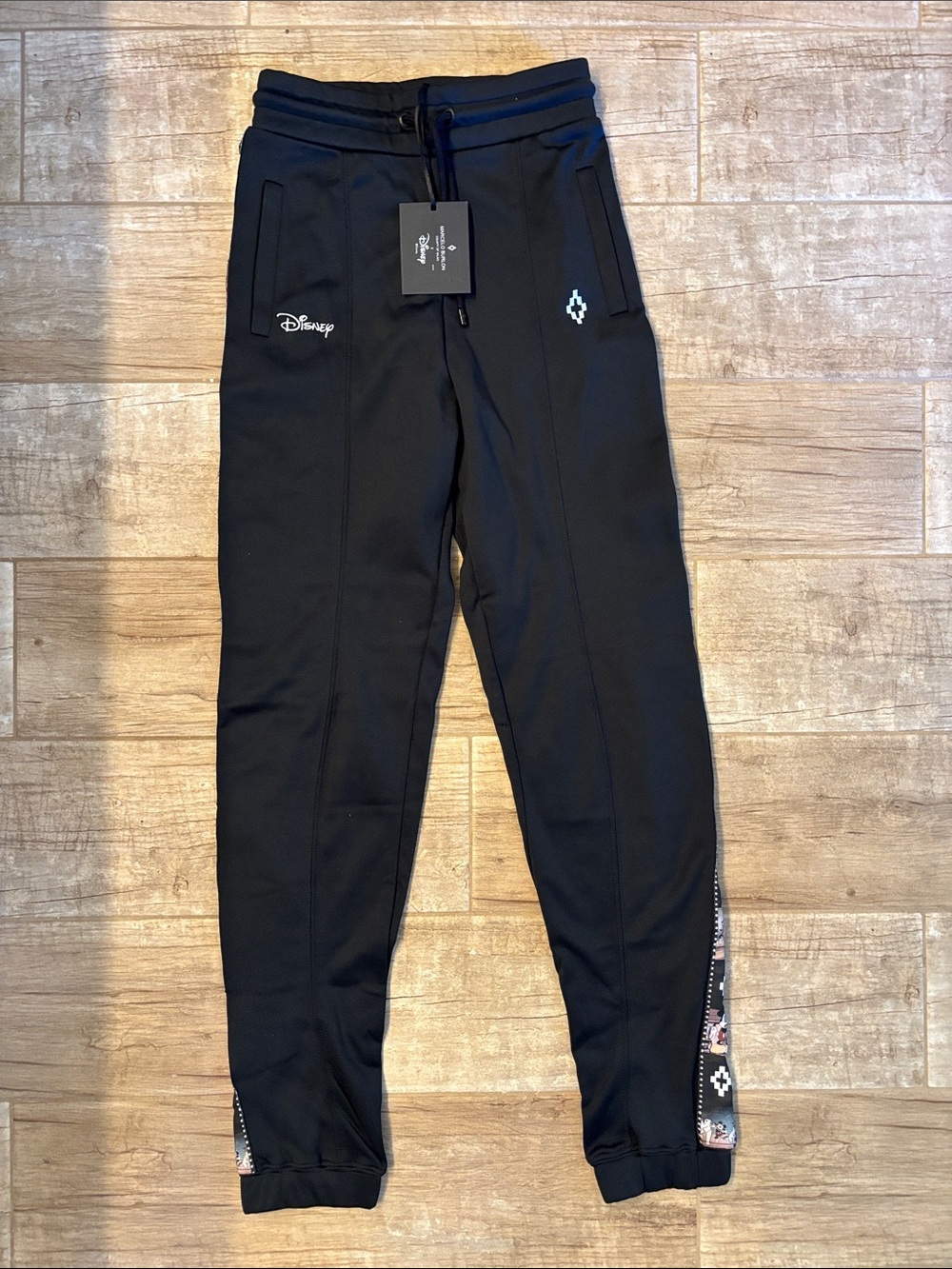 Marcelo Burlon Disney Tape Pants With Mickey Mouse film strip graphic